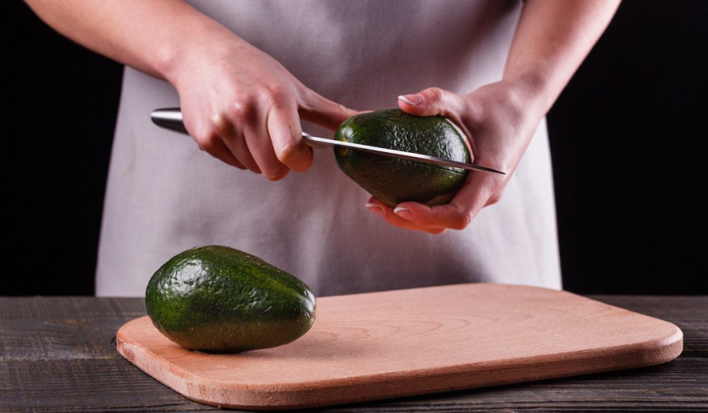woman slicing an avocado