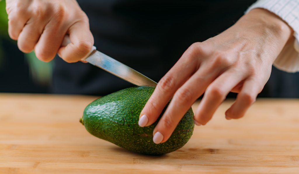 cutting fresh avocado